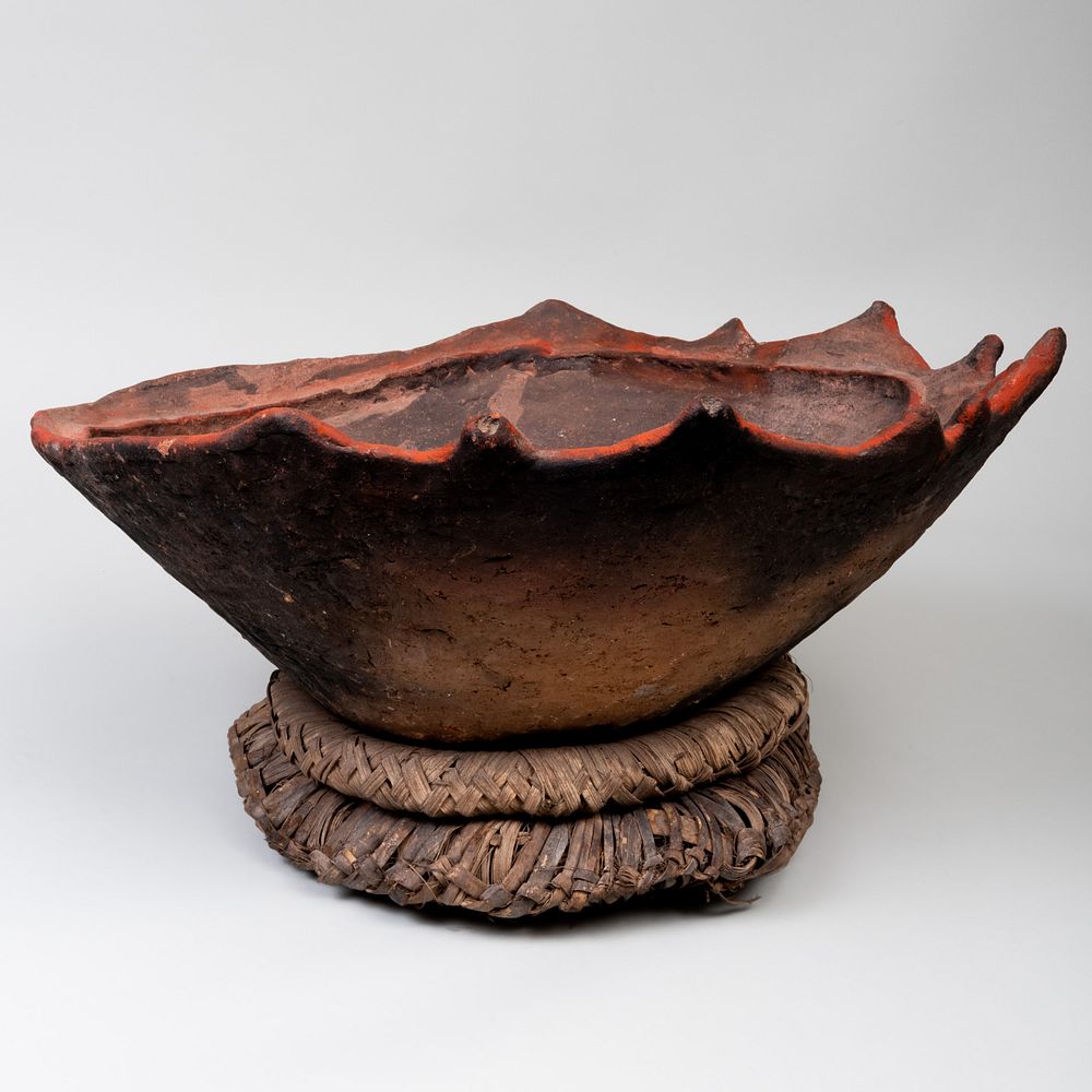 Appraisal: Modern Wood Fired Pottery Bowl Together with two raffia support