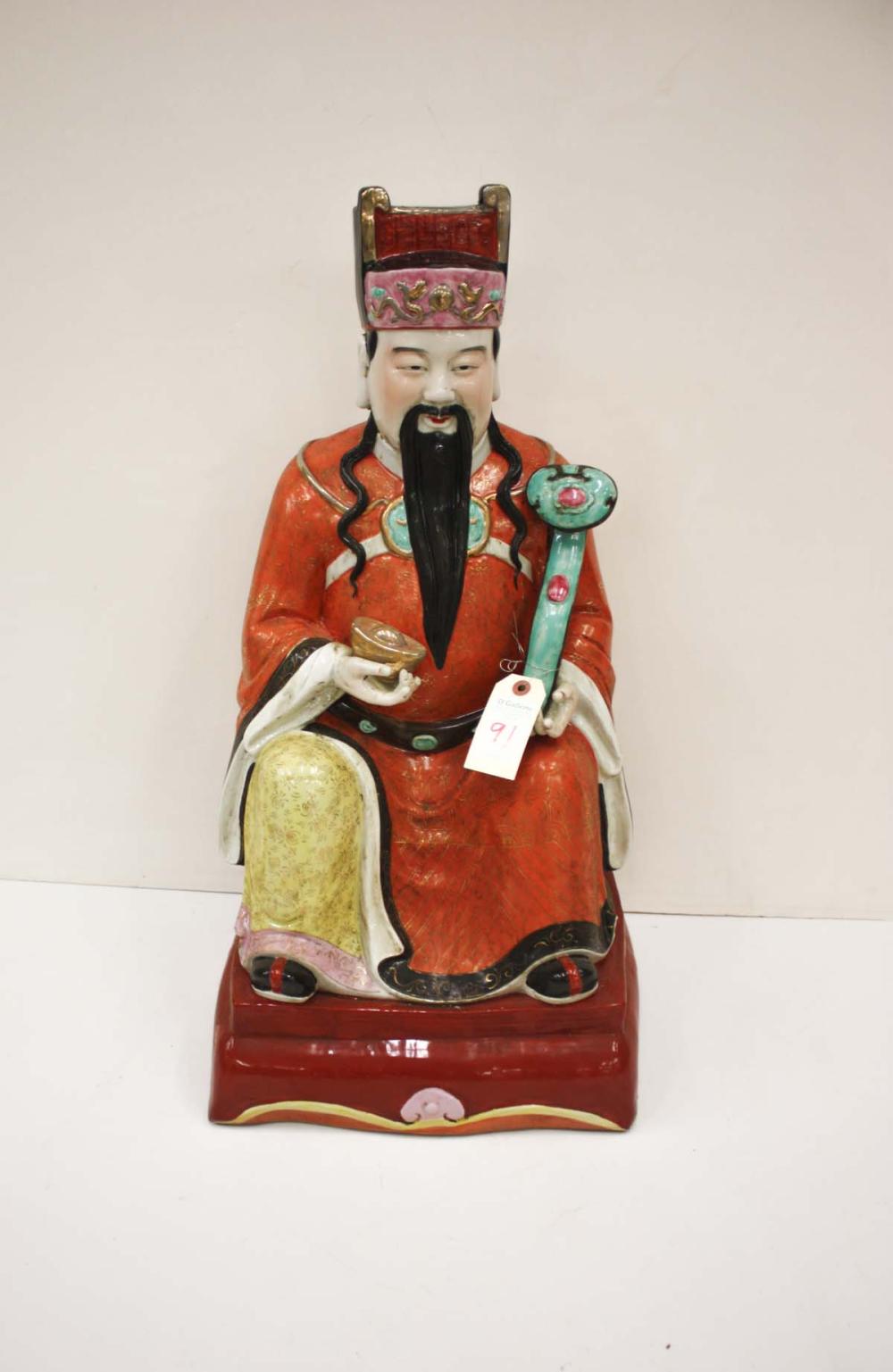 Appraisal: CHINESE PORCELAIN FIGURE a Ming Dynasty emperor in seated pose