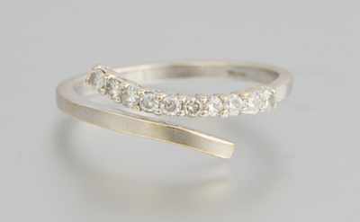 Appraisal: A White Gold and Diamond Bypass Band k white gold