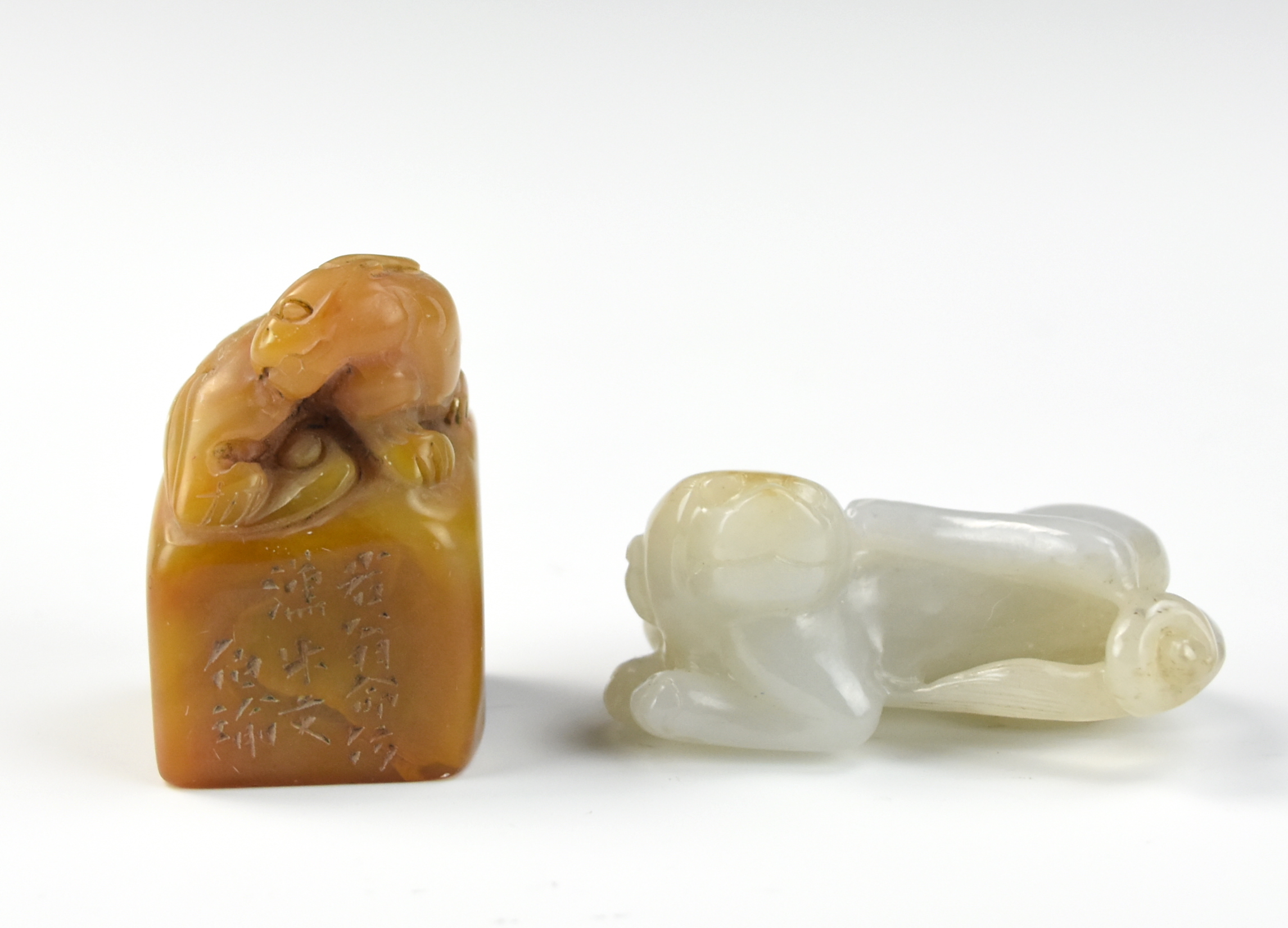 Appraisal: CHINESE JADE FOO-DOG AND SOAPSTONE SEAL Chinese surmounting by a