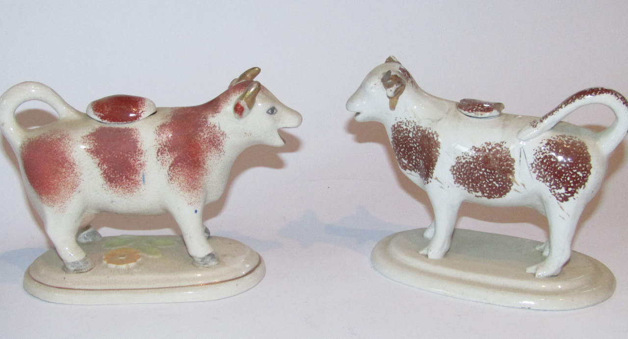 Appraisal: A late thC Staffordshire pottery cow creamer with tail handle