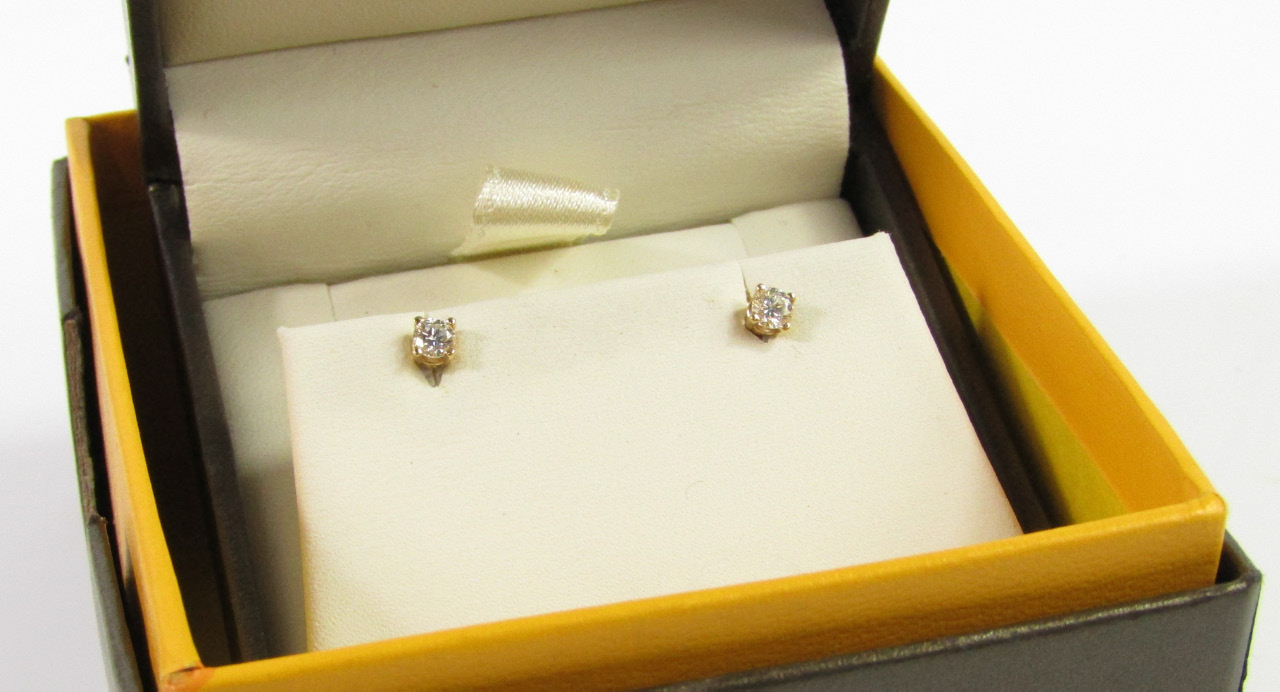 Appraisal: A pair of ct gold and diamond ear studs approx