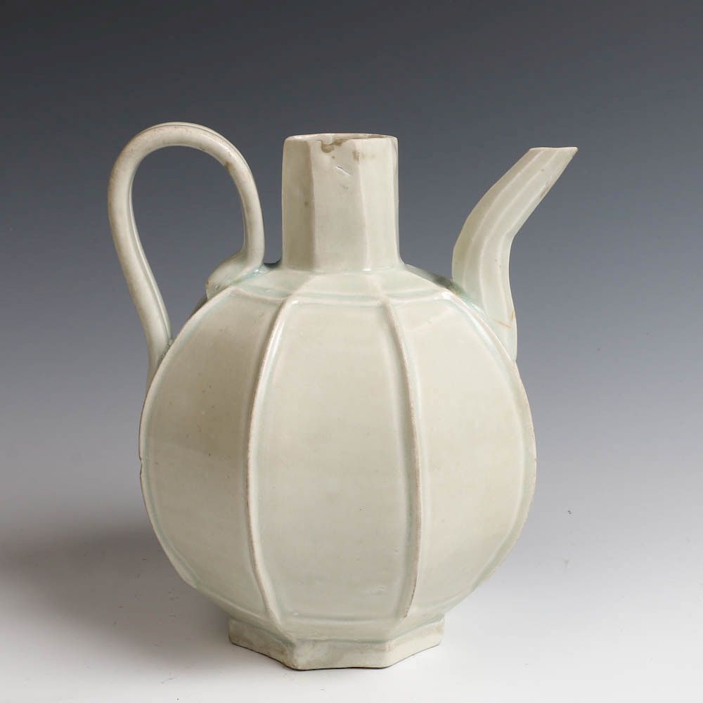 Appraisal: CHINESE WHITE GLAZE EWER The globular body divided into eight