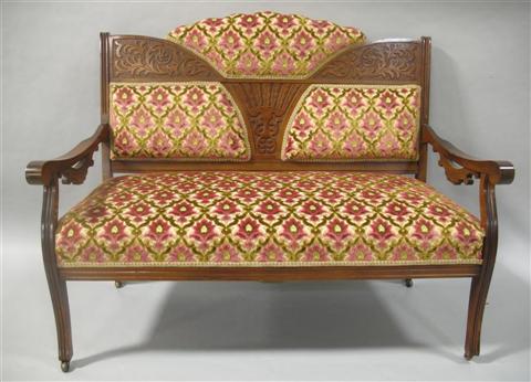 Appraisal: EASTLAKE CARVED MAHOGANY SETTEE Shaped back with carved and upholstered