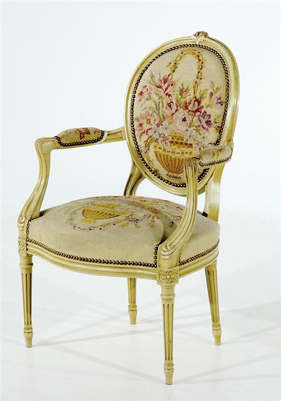 Appraisal: Louis XVI style painted fauteuil th century oval needlework upholstered