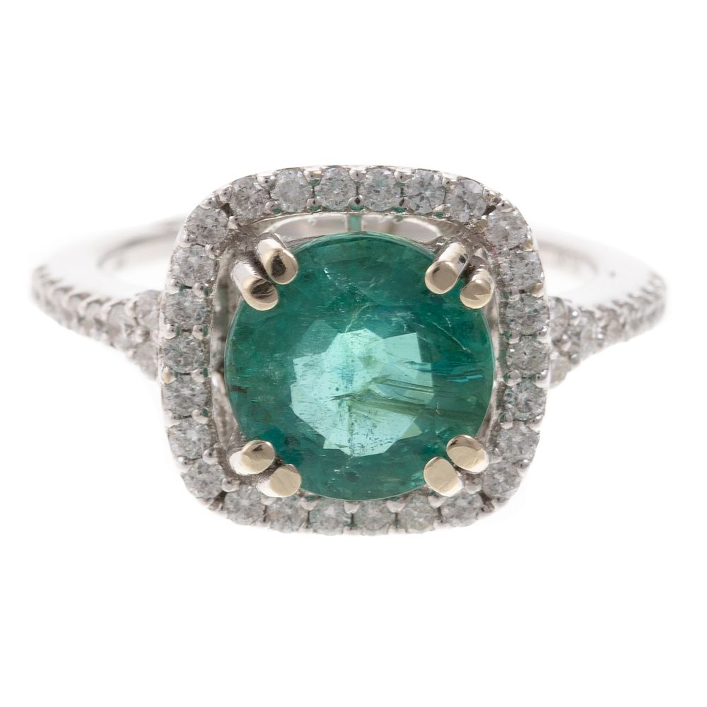 Appraisal: An Emerald Diamond Halo Ring in K K white gold