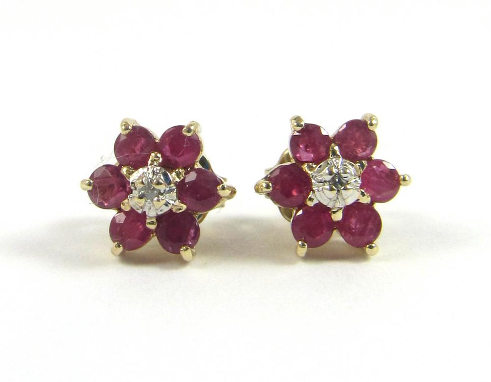 Appraisal: PAIR OF RUBY AND FOURTEEN KARAT GOLD EAR STUDS each