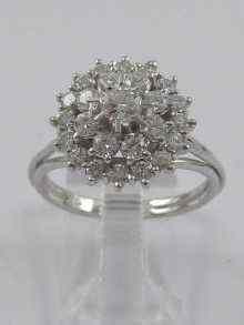 Appraisal: A white metal tests ct gold diamond cluster ring the