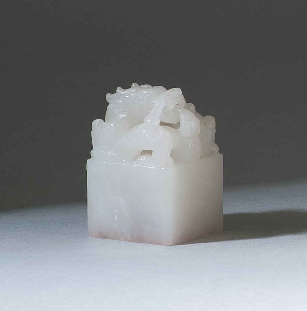 Appraisal: WHITE JADE SEAL In square form with dragon finial Base