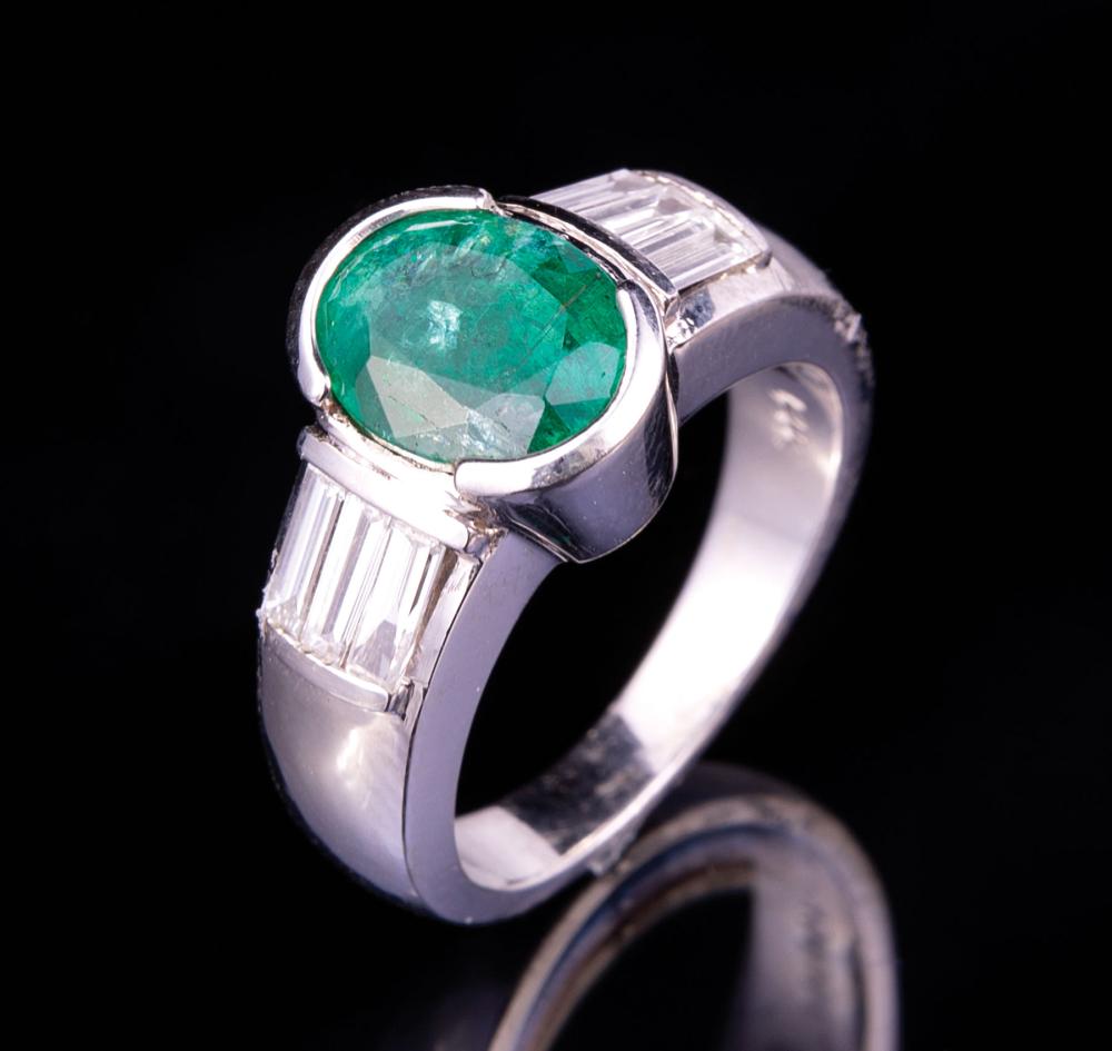 Appraisal: kt White Gold Emerald and Diamond Ring half bezel set