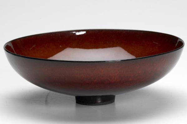 Appraisal: JAMES LOVERA Footed ceramic bowl covered in fine mahogany glossy