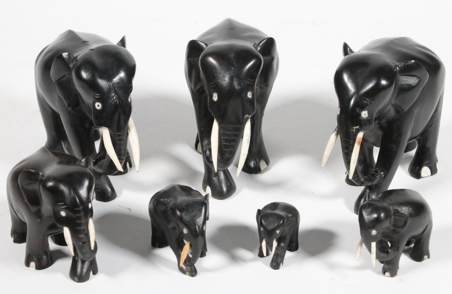 Appraisal: CARVED EBONY ELEPHANTS Collection of Elephant Figurines in carved ebony