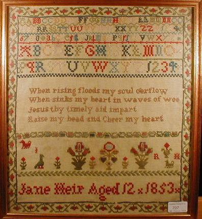 Appraisal: A Victorian needlework sampler with alphabet over text 'when rising