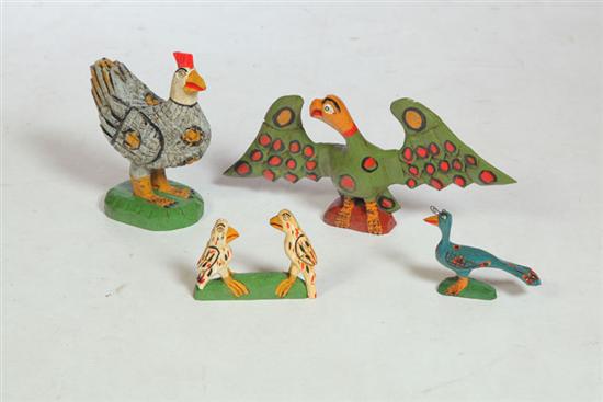 Appraisal: FOUR FOLK ART BIRDS American late th century softwood with