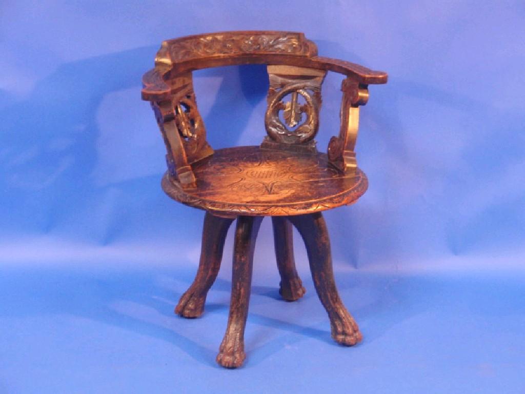 Appraisal: A late thC carved oak armchair the hoop back with