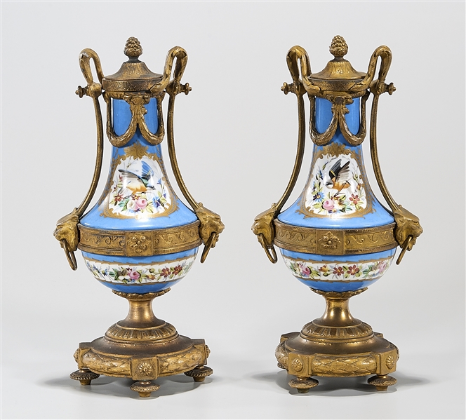 Appraisal: Pair of Sevres-style ormolu mounted urns blue ground porcelain with