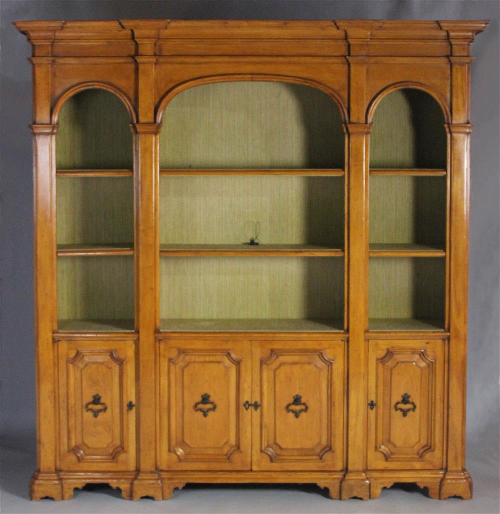 Appraisal: GEORGIAN STYLE CHERRYWOOD THREE PART ARCHITECTURAL BOOKCASE the molded and