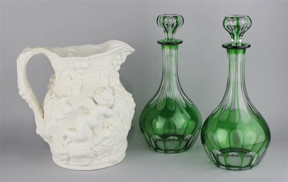 Appraisal: A RELIEF DECORATED BACCHUS WINE JUG TOGETHER WITH A PAIR