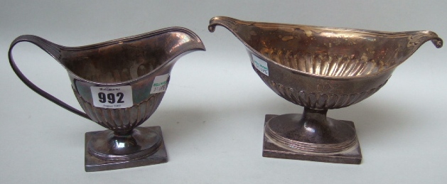 Appraisal: A silver milk jug and a matching twin handled sugar