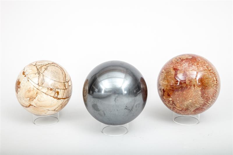 Appraisal: Three Decorative Marble Spheres On lucite ring stands in diam