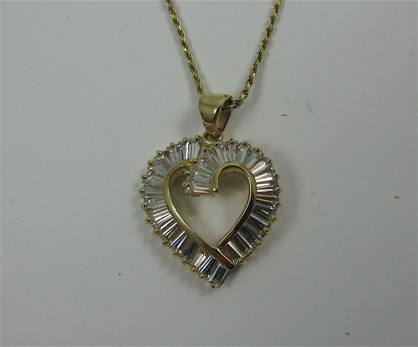 Appraisal: DIAMOND AND K GOLD PENDANT NECKLACE the heart shaped pendant