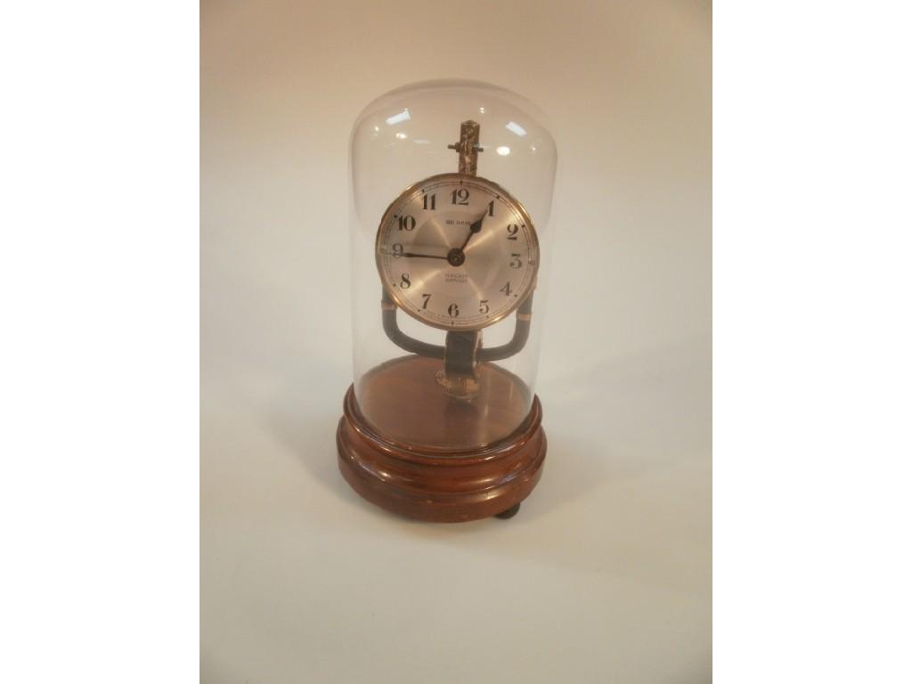 Appraisal: A Pinchin Johnson electric mantel time piece with glass dome