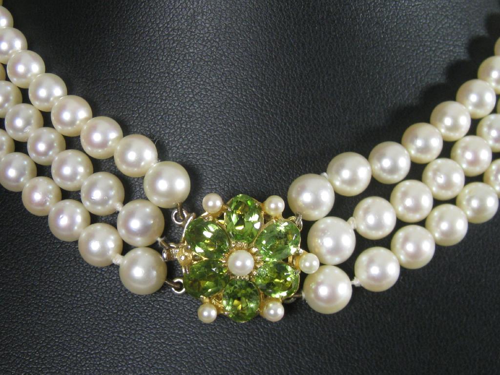 Appraisal: A Three strand Cultured Pearl Necklace graduated from the back