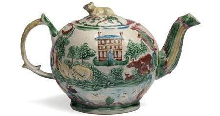 Appraisal: STAFFORDSHIRE SALTGLAZE ENAMELLED LANDSKIP TEAPOT AND COVER CIRCA Of lobed