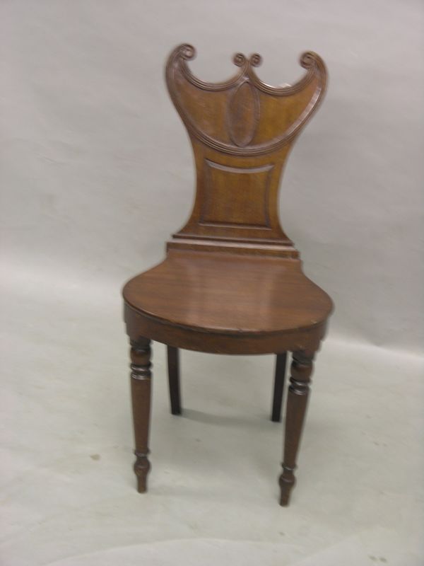 Appraisal: A Victorian mahogany hall chair double-scroll back with reeded detail