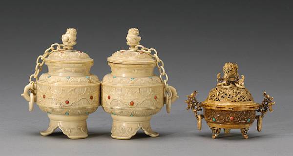 Appraisal: A group of two tinted and pieced ivory covered vessels