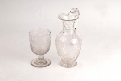 Appraisal: A Victorian engraved glass ewer and similar rummer