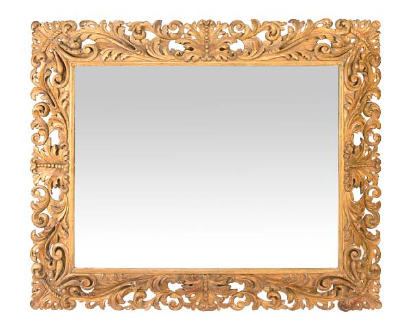 Appraisal: A R gence style carved pine mirror The rectangular plate