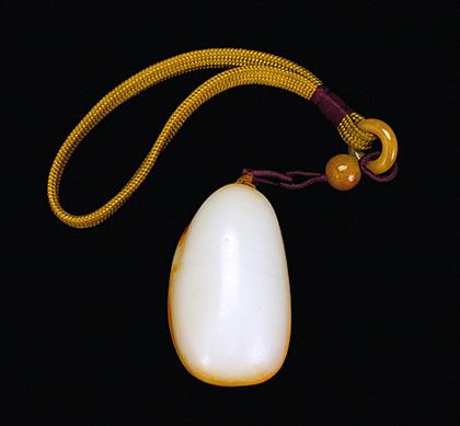 Appraisal: Chinese white jade 'pebble' pendant Of broad oval form white