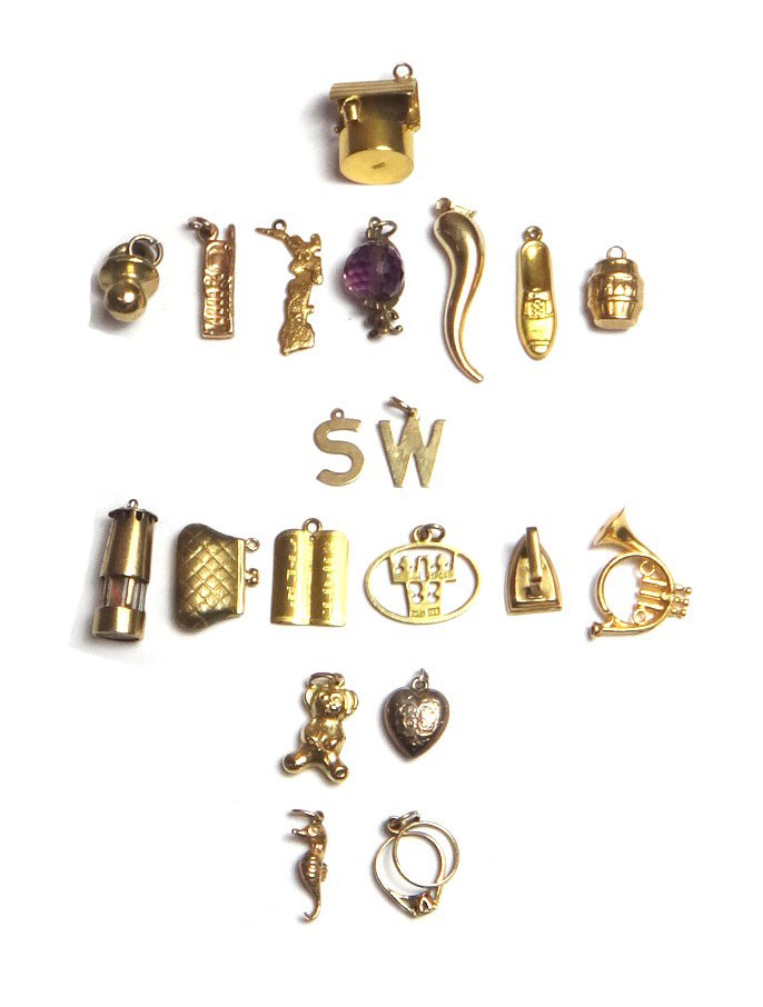 Appraisal: Twenty ct gold gilt and other pendants and charms including