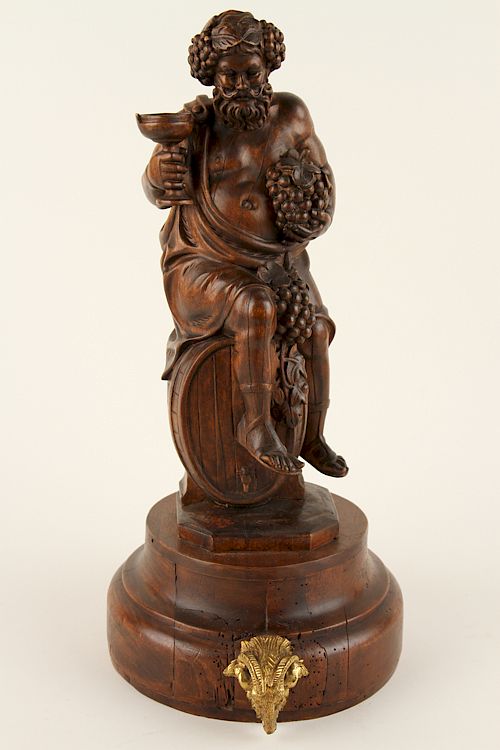 Appraisal: CARVED WOOD BACCHUS FIGURE RAMS HEAD MOUNT A carved wood