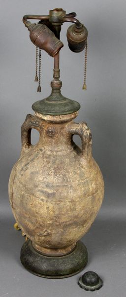 Appraisal: th th Century or older unglazed eartheware jar mounted as