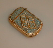 Appraisal: A brass and enamel decorated reproduction vesta