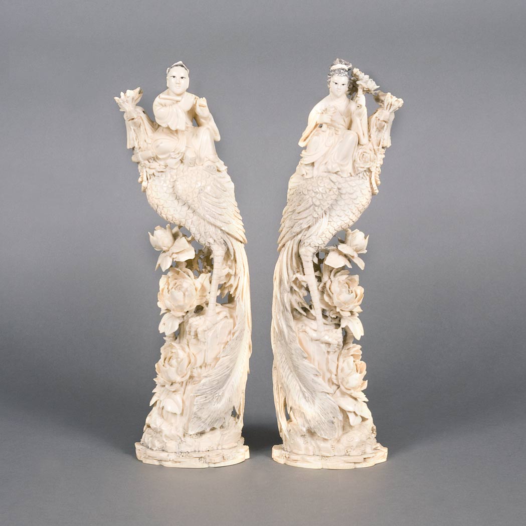 Appraisal: Pair of Chinese Ivory Phoenix Early th century Each depicting