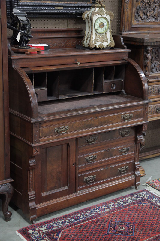 Appraisal: ROLL TOP DESK AND CHAIR Walnut roll top desk with