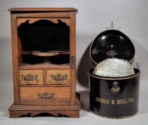 Appraisal: A late Victorian oak ''Smoker's Cabinet'' the fitted interior with