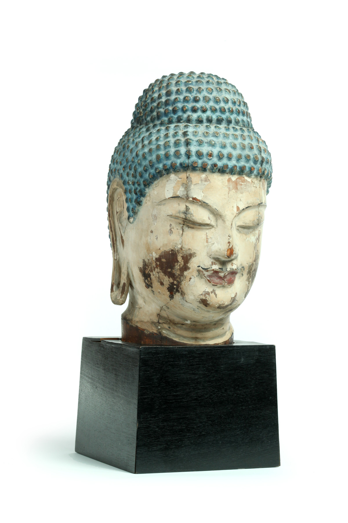 Appraisal: CARVED WOODEN BUST OF BUDDHA Asian early th century Original