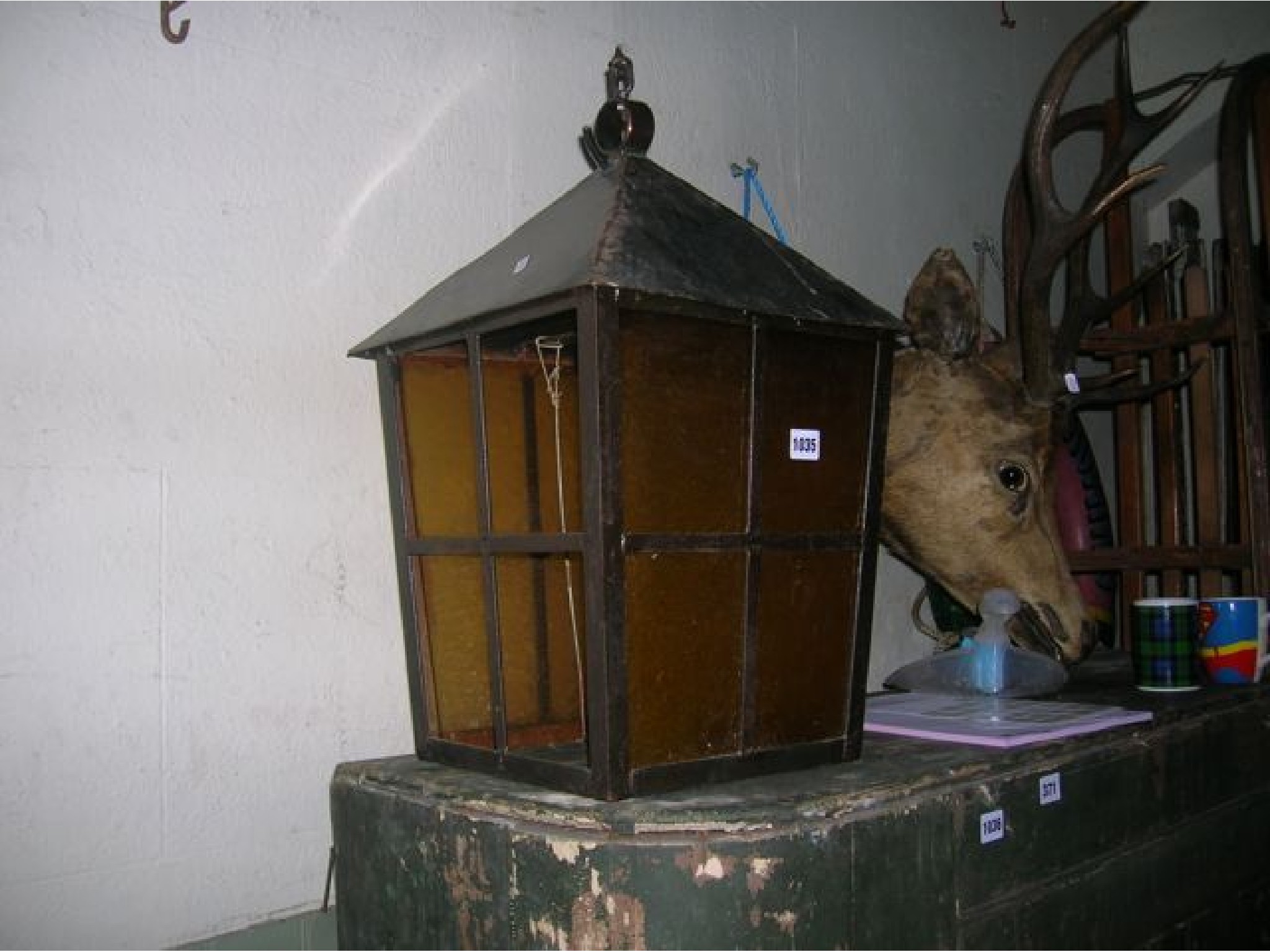 Appraisal: A hanging porch lantern steel framed square tapered with glazed