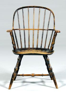 Appraisal: American Windsor armchair sack back with carved grips shaped plank