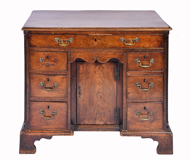 Appraisal: A GEORGE III MAHOGANY KNEEHOLE DESK with single drawer above