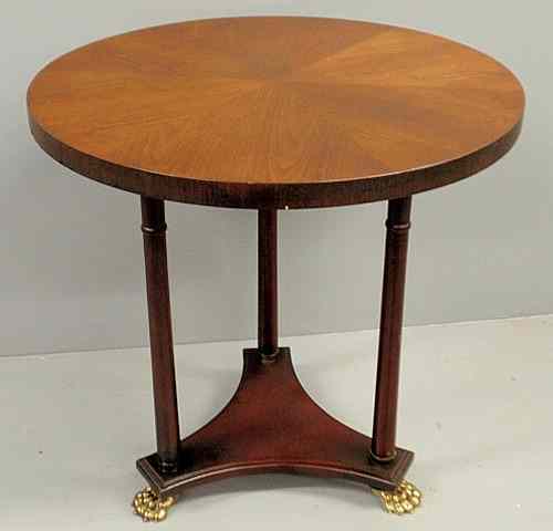 Appraisal: French style mahogany table with round top and three columnar