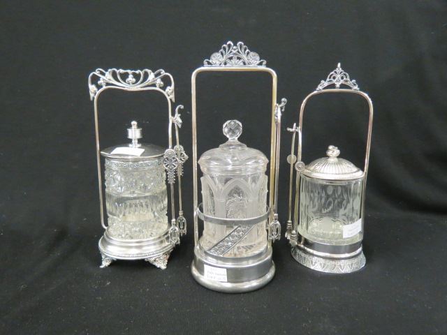 Appraisal: Victorian Silverplate Pickle Castors various pattern glass inserts circa tall