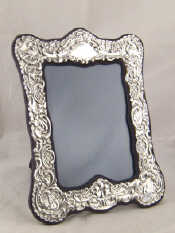 Appraisal: A silver faced photo frame with strut back London x