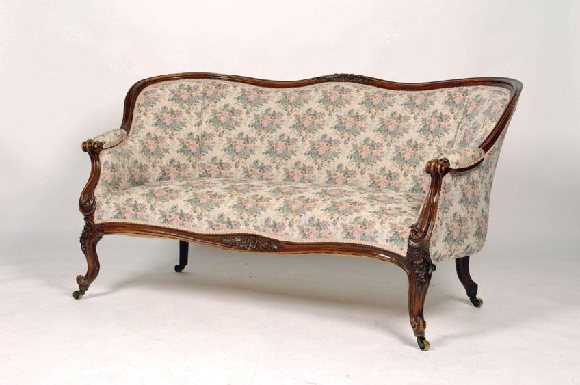 Appraisal: A VICTORIAN MAHOGANY SCROLL BACK SETTEE the frame carved with