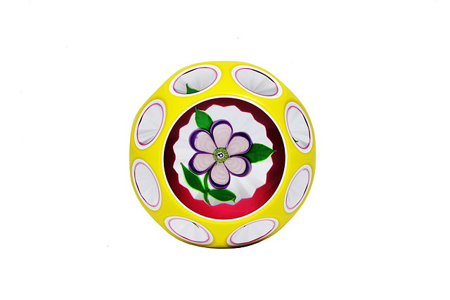 Appraisal: A PERTHSHIRE YELLOW AND WHITE OVERLAY FACET CUT PAPERWEIGHT with