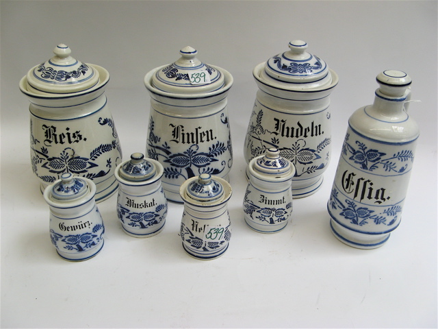 Appraisal: EIGHT PIECE GERMAN FOOD SPICE POTTERY SET decorated after the